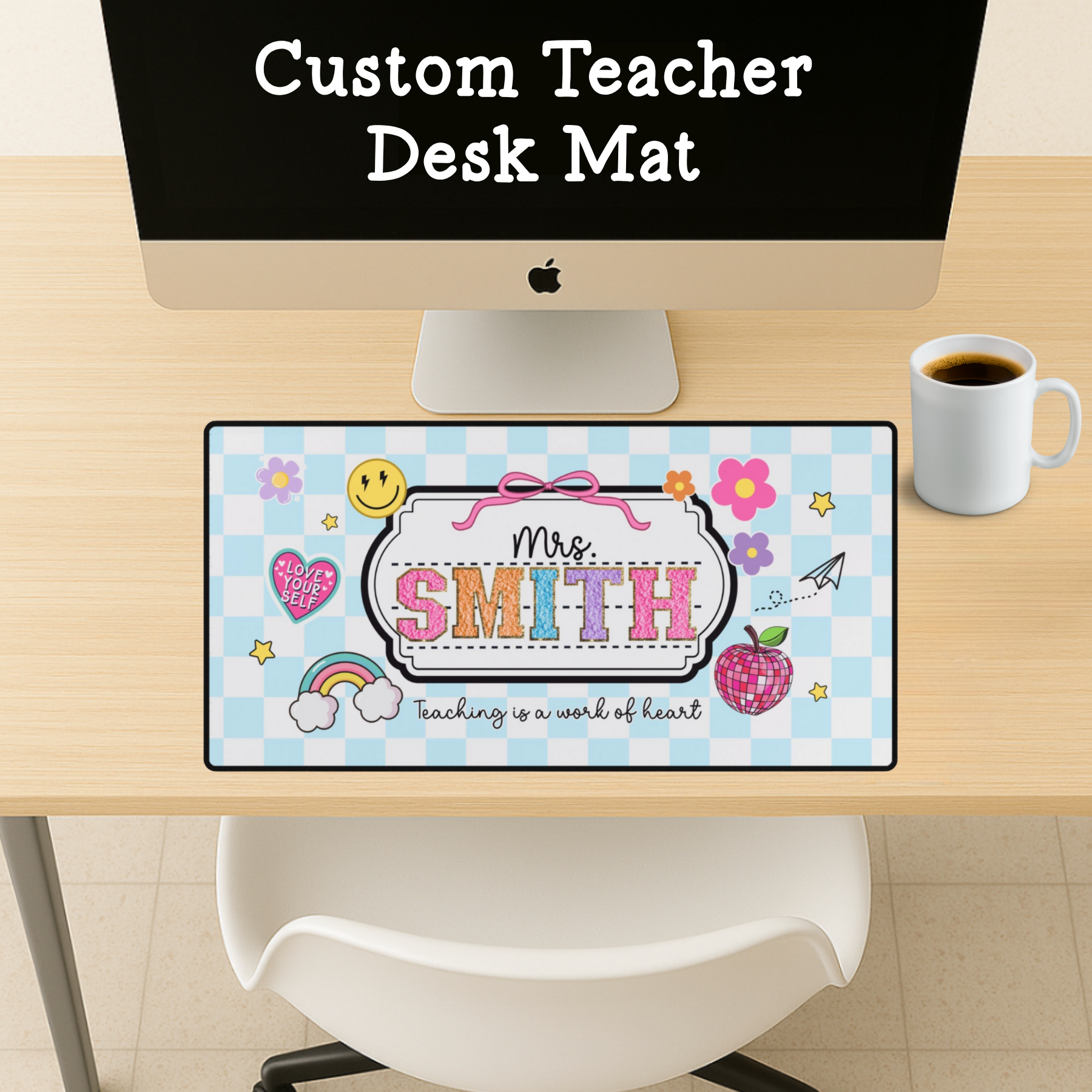 Custom teacher desk mat with 'Mrs. Smith' design on a desk with a computer and coffee cup.